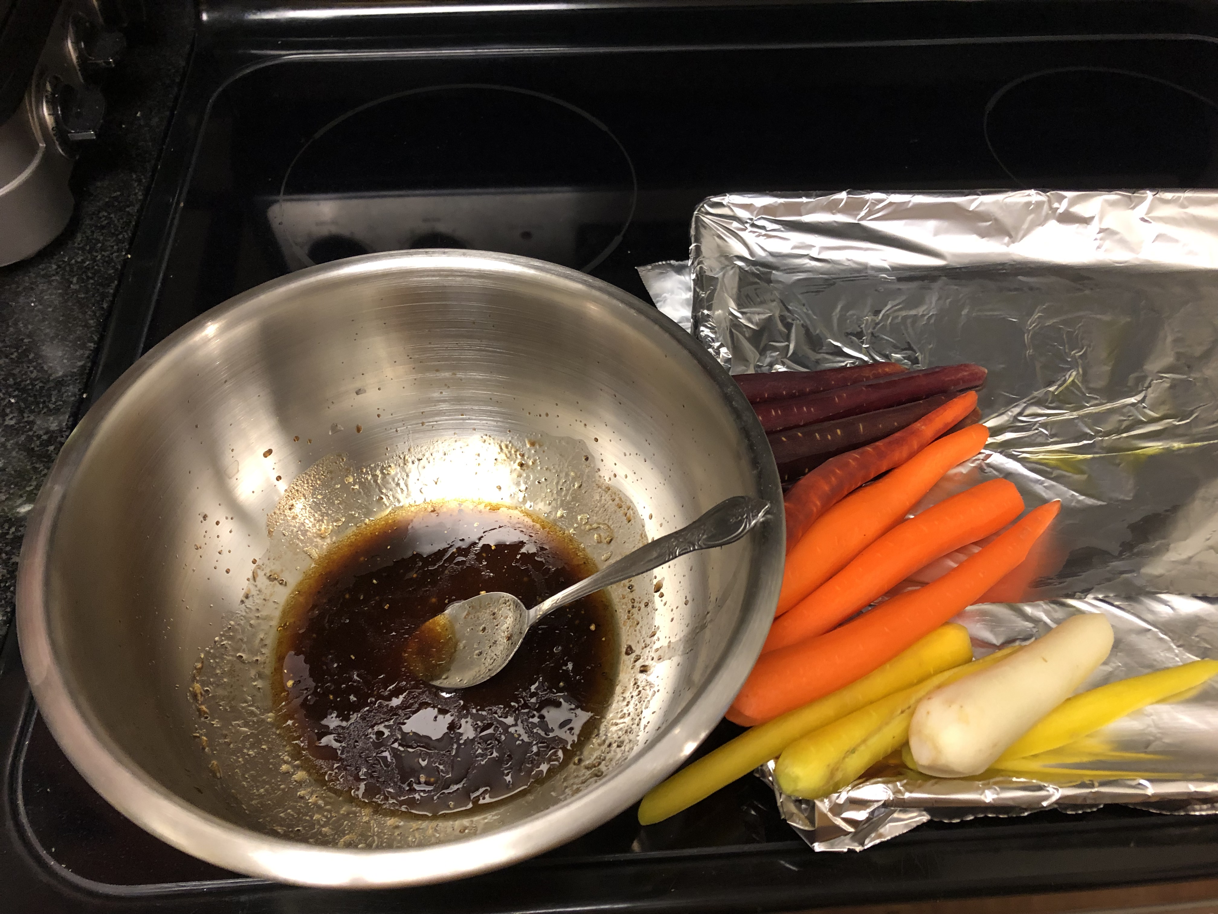 Peeled carrots beside mixing bowl