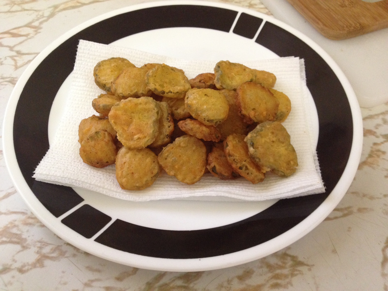 Fried pickles resting on a plate