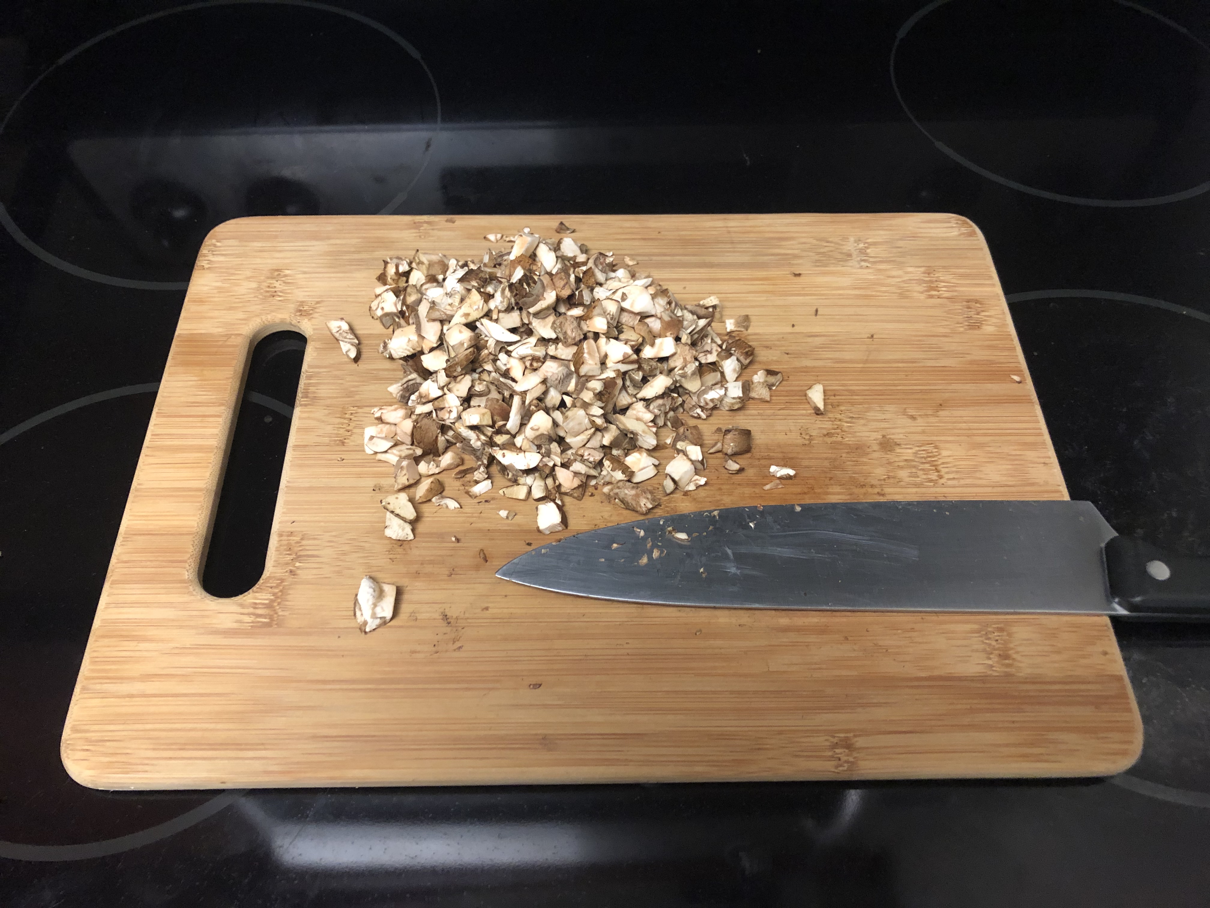 Chopped mushrooms on cutting board