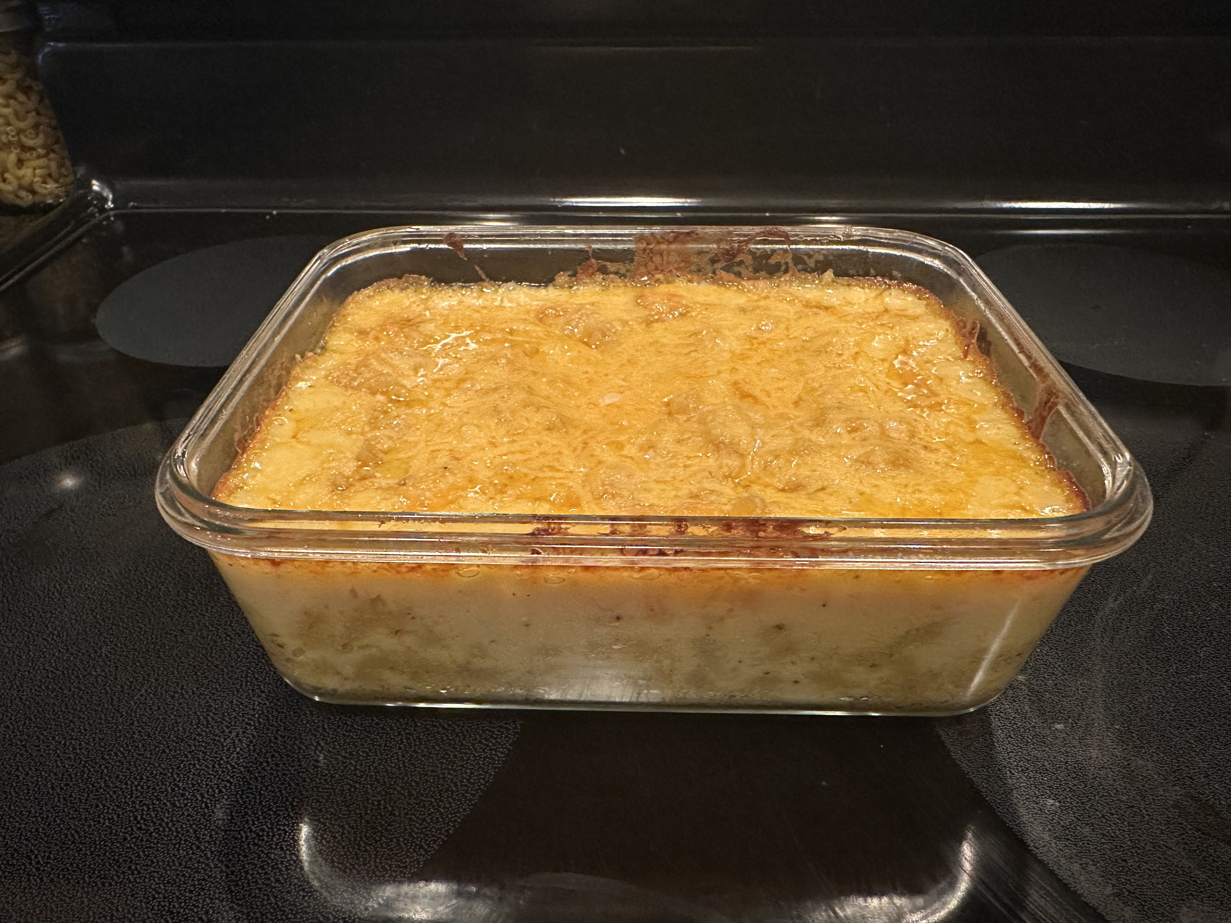 Macaroni fresh out of the oven in a casserole dish